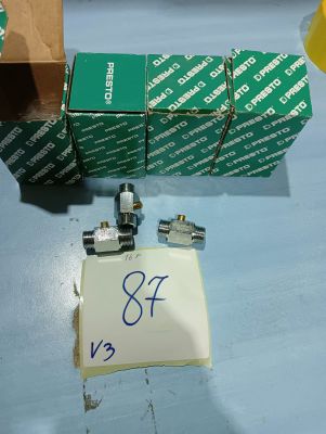 a box of green boxes on a table next to a pair of scissors