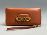 a brown leather wallet with a gold chain on the clasp