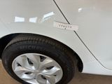 a white car with a sticker on the side of it