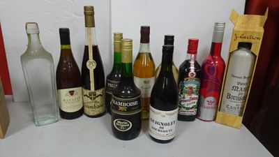 many bottles of alcohol on the counter next to each other