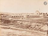 an old photo of a view of a city from the top of a hill