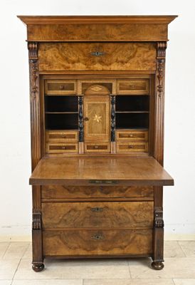 an old wooden desk with drawers and drawers on top of it