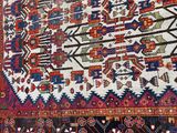 a large rug on the ground next to a wall