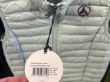 a person holding a tag in front of a jacket