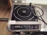 an image of a stove top with a timer on it