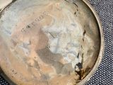 a small metal container that has a lid on it