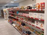 a lot of food on the shelves in the store