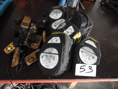 many pairs of shoes that are sitting on a table