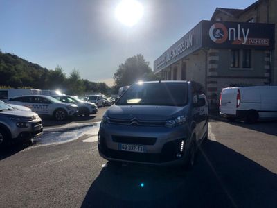 cars parked in a parking lot in front of a building