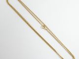 a gold chain necklace with a heart charm hanging from it
