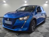 the blue car is parked on a checkered floor in the garage