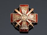 an image of a badge with a cross on it