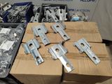 a lot of different types of metal parts in a box