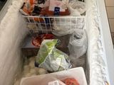 a refrigerator that has a lot of food inside of it