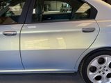 a silver car that is parked in a garage