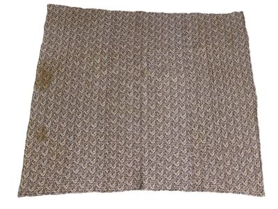 a close up of a brown and white blanket on a white background