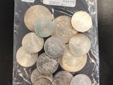 a bag full of coins sitting on a table