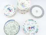 several plates with different designs and designs on them on a white surface