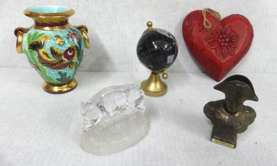 three vases and a bird on a table