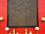 a painting on the wall above a desk in a room