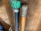 two baseball bats sitting on a table next to a bag