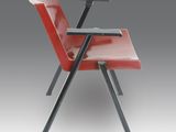 an image of a red chair with a laptop on top of it