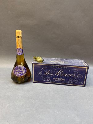 a bottle of wine next to a box of wine