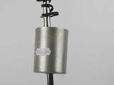 a close up of a metal object on a black pole