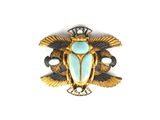une image représentant une broche en or et turquoise sur fond blanc
