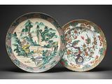 two chinese plates with birds and flowers on them on a black background