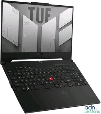 L'ordinateur portable est noir et comporte un bouton rouge sur le clavier.