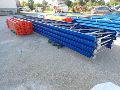 many different types of steel pipes in a parking lot