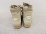 pair of beige boots with zippers on them on a white surface