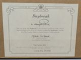 an image of a box with a certificate on it sitting on a table