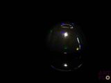 an image of a black vase with colored lights on it