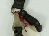 a black leather belt with a tag attached to it