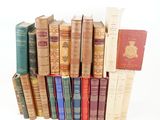 a lot of old books stacked on top of each other