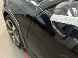 a sticker on the side of a black car