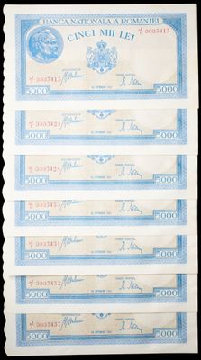 four different bills of different currency are on a black background