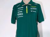 the shirt is green and white with a yellow zipper on the collar