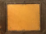 an old picture frame with a brown paper in the middle
