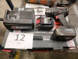 une photo d'une perceuse sans fil et de deux batteries posées sur une table