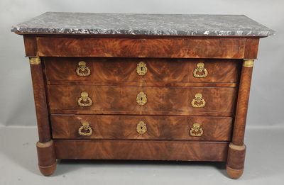 an antique chest of drawers with marble top