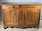 a wooden cabinet with two doors and two drawers