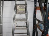 two ladders that are next to each other in a room