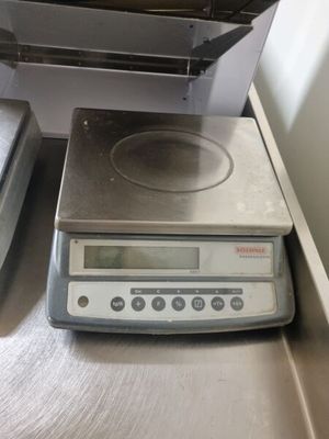 an image of a kitchen scale on a counter top