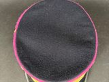 a close up of a hat on a metal surface