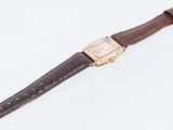 an image of a wrist watch with a brown leather strap