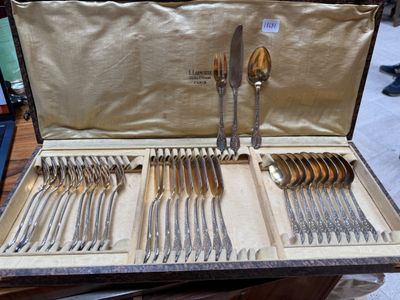 a case that has silverware in it on a table