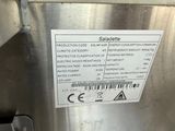 a label on the side of a stainless steel refrigerator